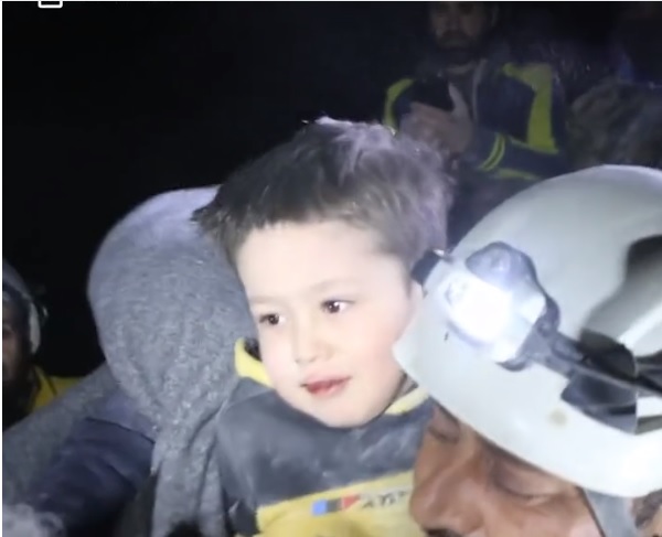 Boy Buried By Earthquake Plays With Rescue Team